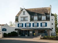 Exterior facade of the Auberge du Cabestan with its characteristic neo-Breton architecture